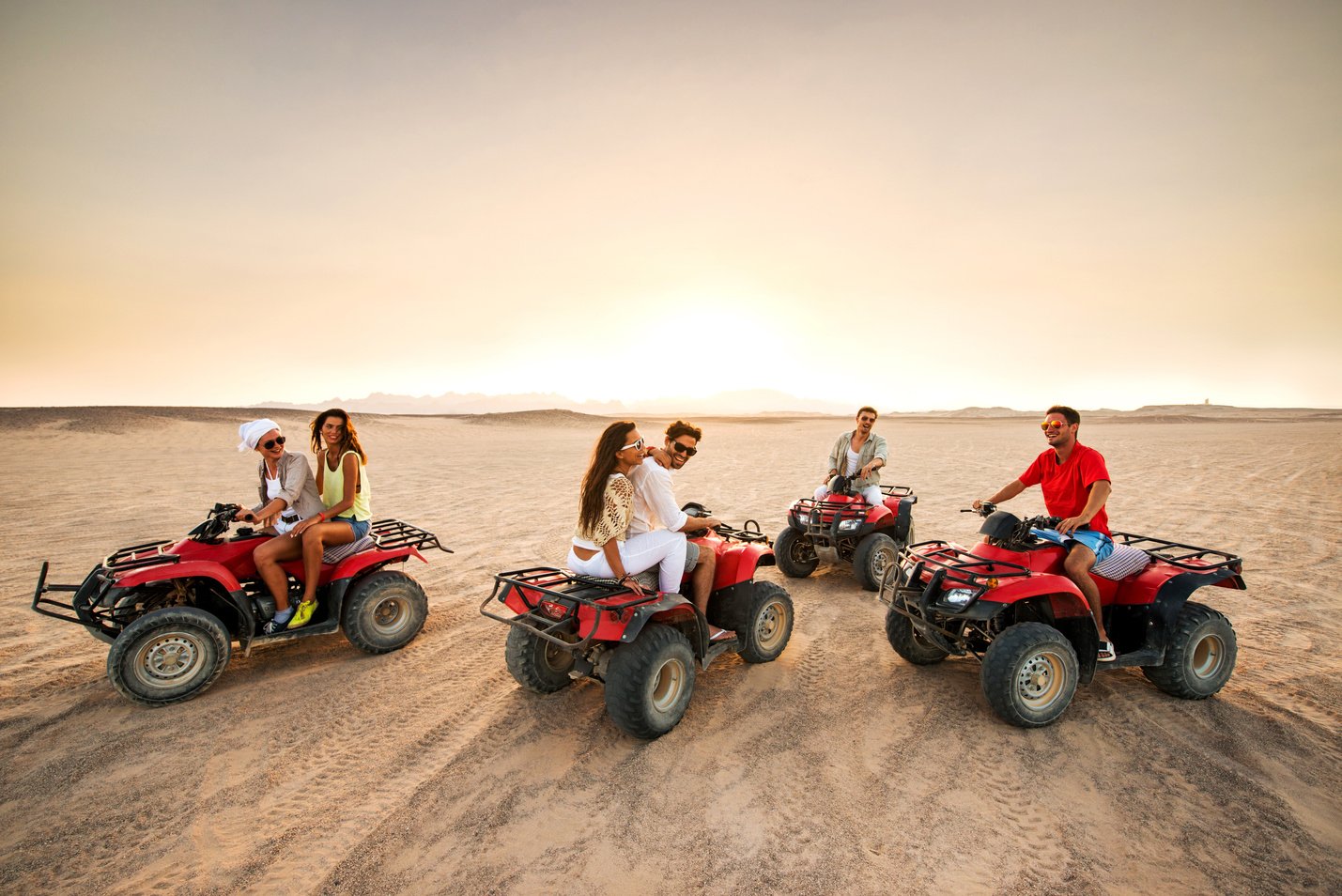 Driving quad bikes in the desert.